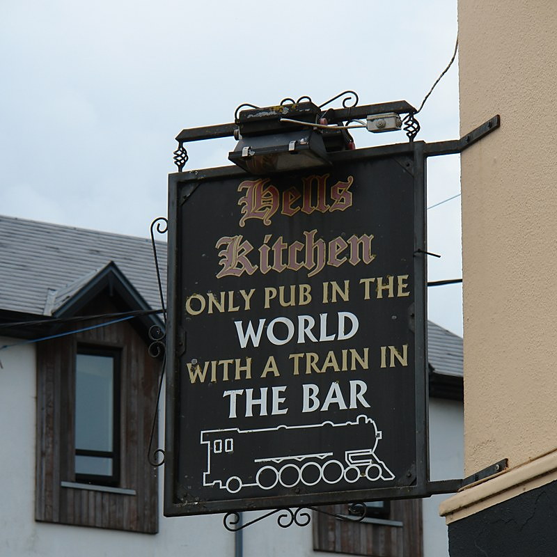 Hell's Kitchen pub sign in Castlerea: only pub in the world with a train in the bar